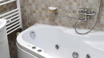 Jetted tub, hair dryer, towels, soap