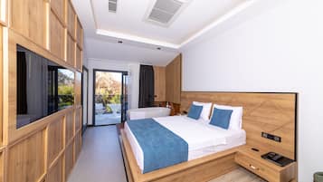 A modern bedroom with a large bed, a wooden wardrobe, and a bathroom visible through a glass door.