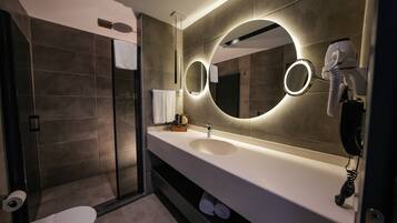 Shower, designer toiletries, hair dryer, slippers