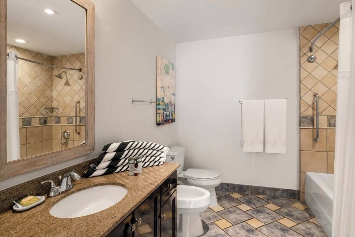 combined shower/bathtub, hair dryer, towels, soap