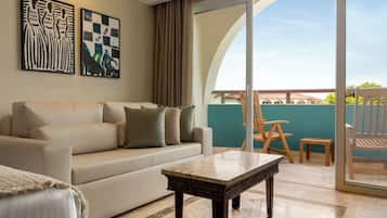 Signature Level Junior Suite Pool Access | Living area | 50-inch Smart TV with cable channels
