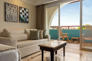 Signature Level Junior Suite Pool Access | Living area | 50-inch Smart TV with cable channels