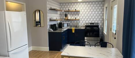 Fridge, microwave, coffee/tea maker, toaster