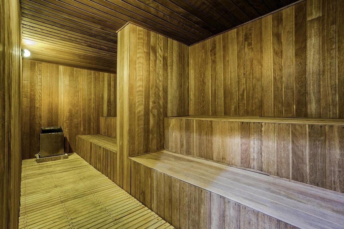 A sauna with wooden walls and benches.