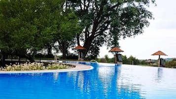 Outdoor pool, pool umbrellas, sun loungers