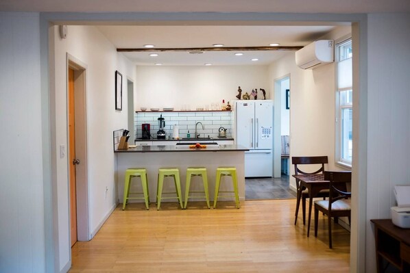 Enjoy cooking in this well-equipped kitchen with a central island and bar stools.