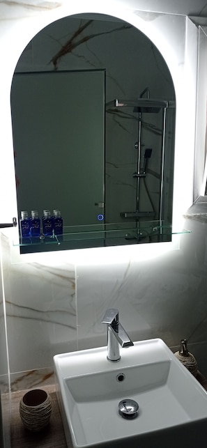 Shower, rainfall showerhead, slippers, towels