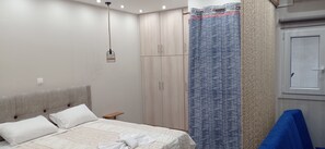 Rideaux occultants, chambres insonorisées, fer et planche à repasser
