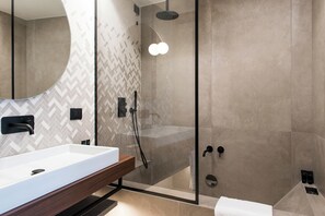 Deluxe room with double bed or 2 single beds | Bathroom | Rainfall showerhead, designer toiletries, hair dryer, slippers