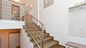 A staircase with wooden steps and metal railings, leading to an upper floor. - Villa 2273/75669 (Istria - Liznjan), 800m from the beach (Liznjan)