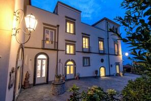 Stunning European-style building with a central courtyard and symmetrical facade.
