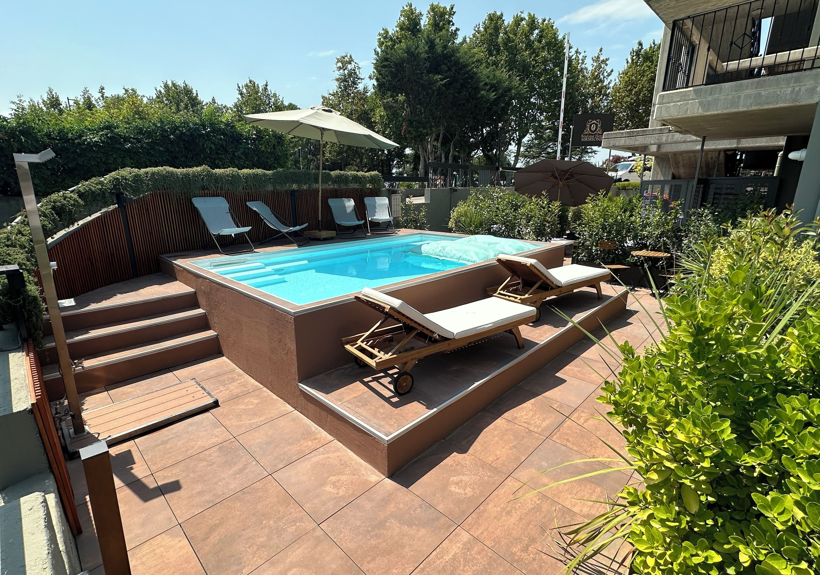 Seasonal outdoor pool, open 9:00 AM to 8:00 PM, pool loungers