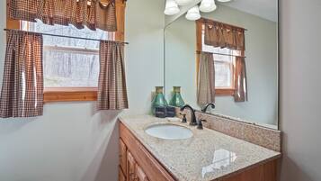 Bathtub, hair dryer, towels