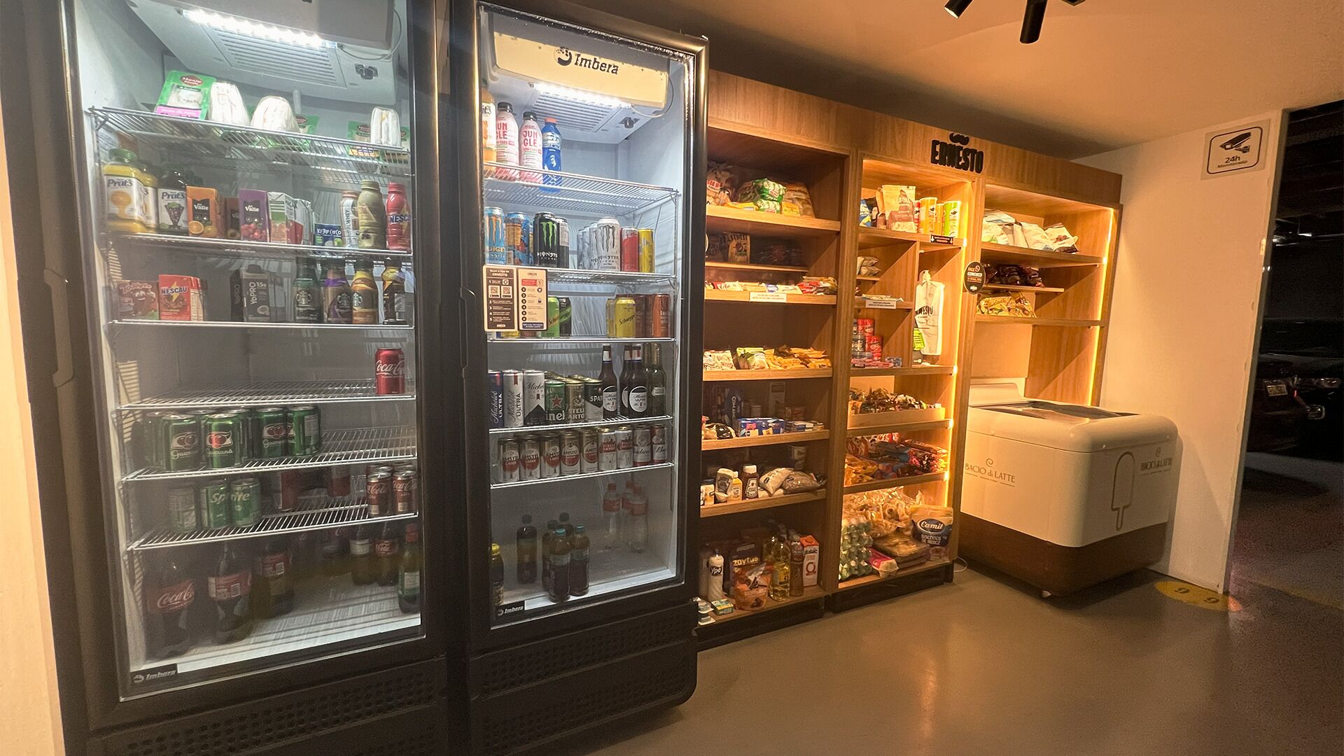 A vending machine area with various beverage options and a coffee machine.