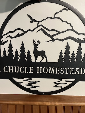 A sign with a deer and trees, and the text "CHUCLE HOMESTEAD". - Chucle Homestead - Charming 3 bdrm, 2 bath ranch home (Maryland)