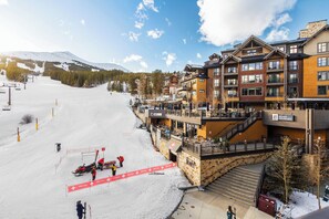A ski resort with a first aid station, ski lifts, and a mountain in the background. - Ski-in/out Grand Colorado Peak 8 - 1 BD Colorado (Breckenridge)