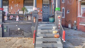 A front porch decorated with Halloween pumpkins and a spider web. - < 2 Mi to Downtown & Capitol: Harrisburg Hideaway (Harrisburg)