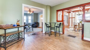 A spacious living room with hardwood floors, a dining area with a table and chairs, and a cozy seating area with a fireplace. - Pet-Friendly Penn Yan Home: Wineries, Parks, Lakes (Penn Yan)