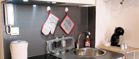 Fridge, microwave, stovetop, coffee/tea maker
