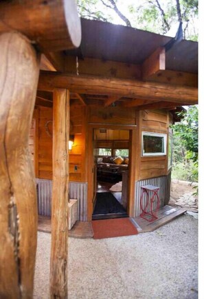 Cozy cabin with a fireplace and seating area, perfect for relaxing.