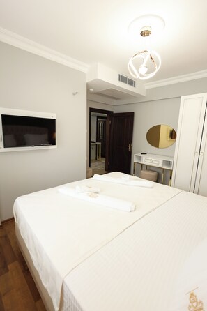 Premium bedding, blackout curtains, soundproofing, iron/ironing board