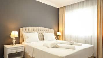 Premium bedding, blackout curtains, soundproofing, iron/ironing board