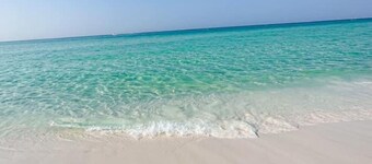 Destin beach condo with private beach access and free par 3 golf course on site.