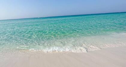 Destin beach condo with private beach access and free par 3 golf course on site.