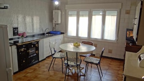 Fridge, microwave, coffee/tea maker, cookware/dishes/utensils