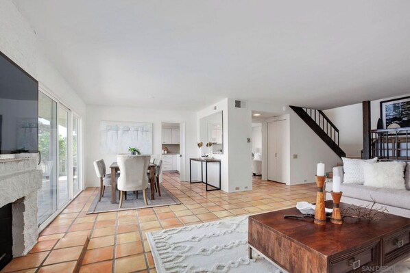 Spacious living area with a kitchen, dining, and seating space.