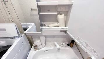 Bathtub, hair dryer, towels