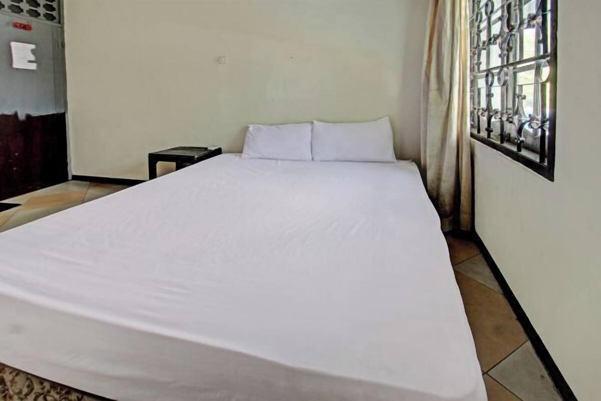 Desk, laptop workspace, bed sheets