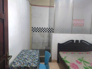 Desk, laptop workspace, bed sheets