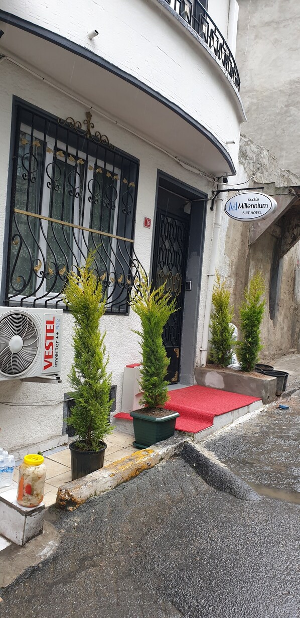 A building with a sign for 'Taksim Millenium Suit Hotel'. - Taksim Millennium Suites (Istanbul)