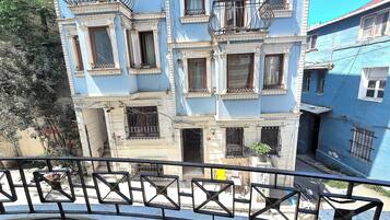 Deluxe Triple Room, Balcony | Terrace/patio