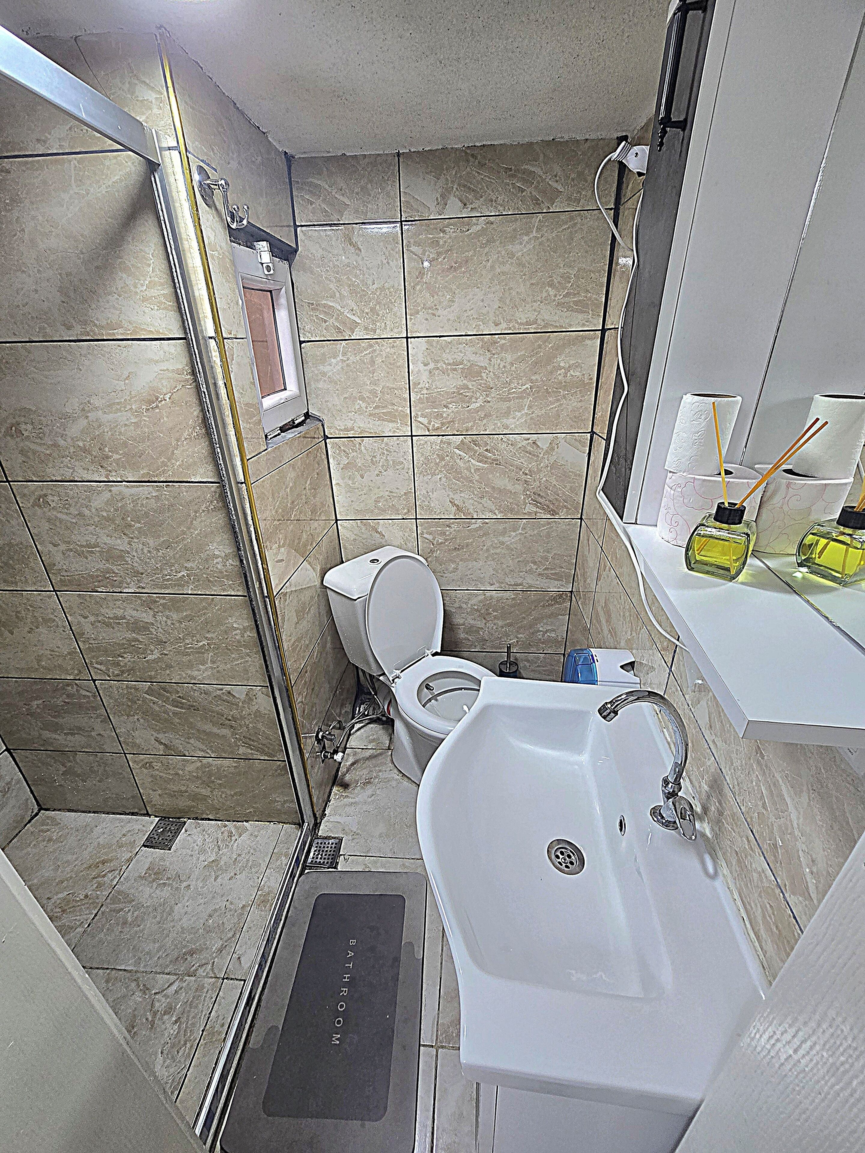 Shower, rainfall showerhead, designer toiletries, hair dryer