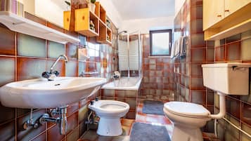 Bathtub, hair dryer, towels