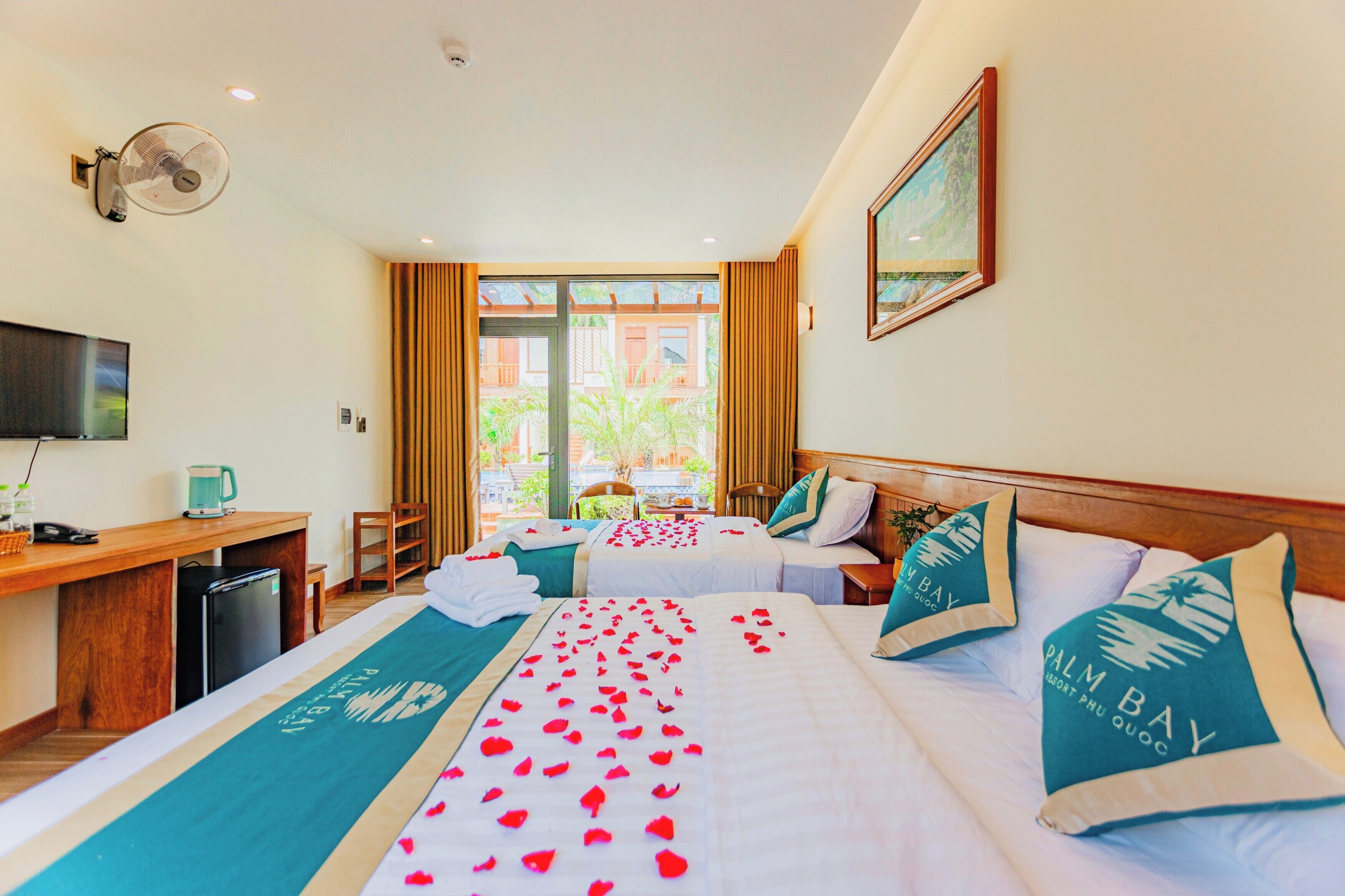 deluxe triple room, 1 bedroom, non smoking, pool view | minibar, desk, laptop workspace, blackout curtains