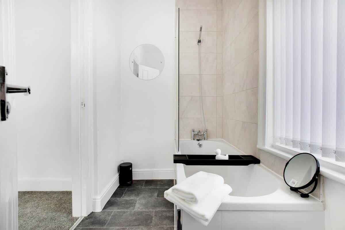 Bathtub, hair dryer, shampoo
