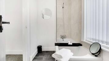 Bathtub, hair dryer, shampoo
