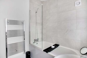 Bathtub, hair dryer, shampoo