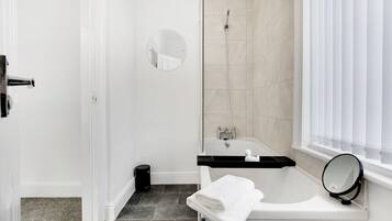 Bathtub, hair dryer, towels