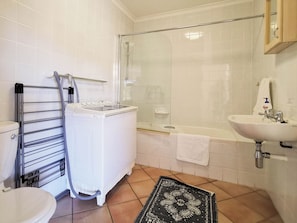 Economy Apartment | Bathroom | Hair dryer, towels, toilet paper