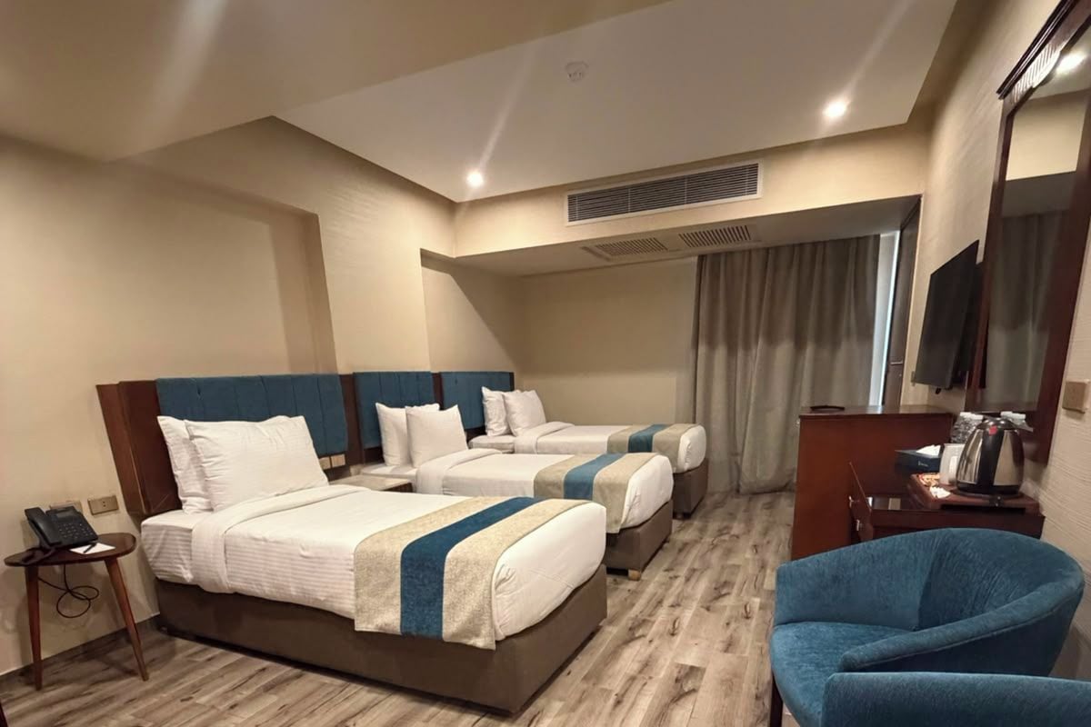 Standard Triple Room | Minibar, iron/ironing board (on request), free WiFi, bed sheets