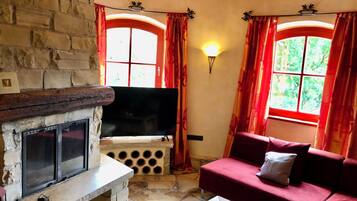 Smart TV, fireplace, foosball, books