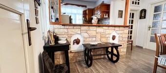 The house is located in the central square of the historical village Kynidaros