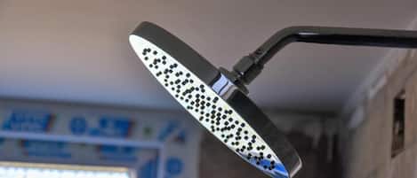 A showerhead with a unique pattern of holes.