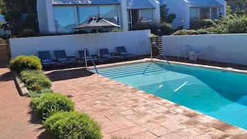 Outdoor pool, open 8:00 AM to 8:00 PM, pool umbrellas, pool loungers