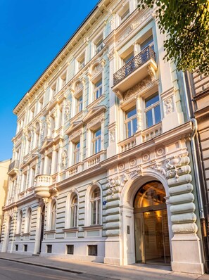 A historic building with ornate architectural details, including columns, decorative moldings, and a grand entrance.
