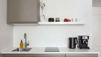 Fridge, stovetop, coffee/tea maker, cookware/dishes/utensils